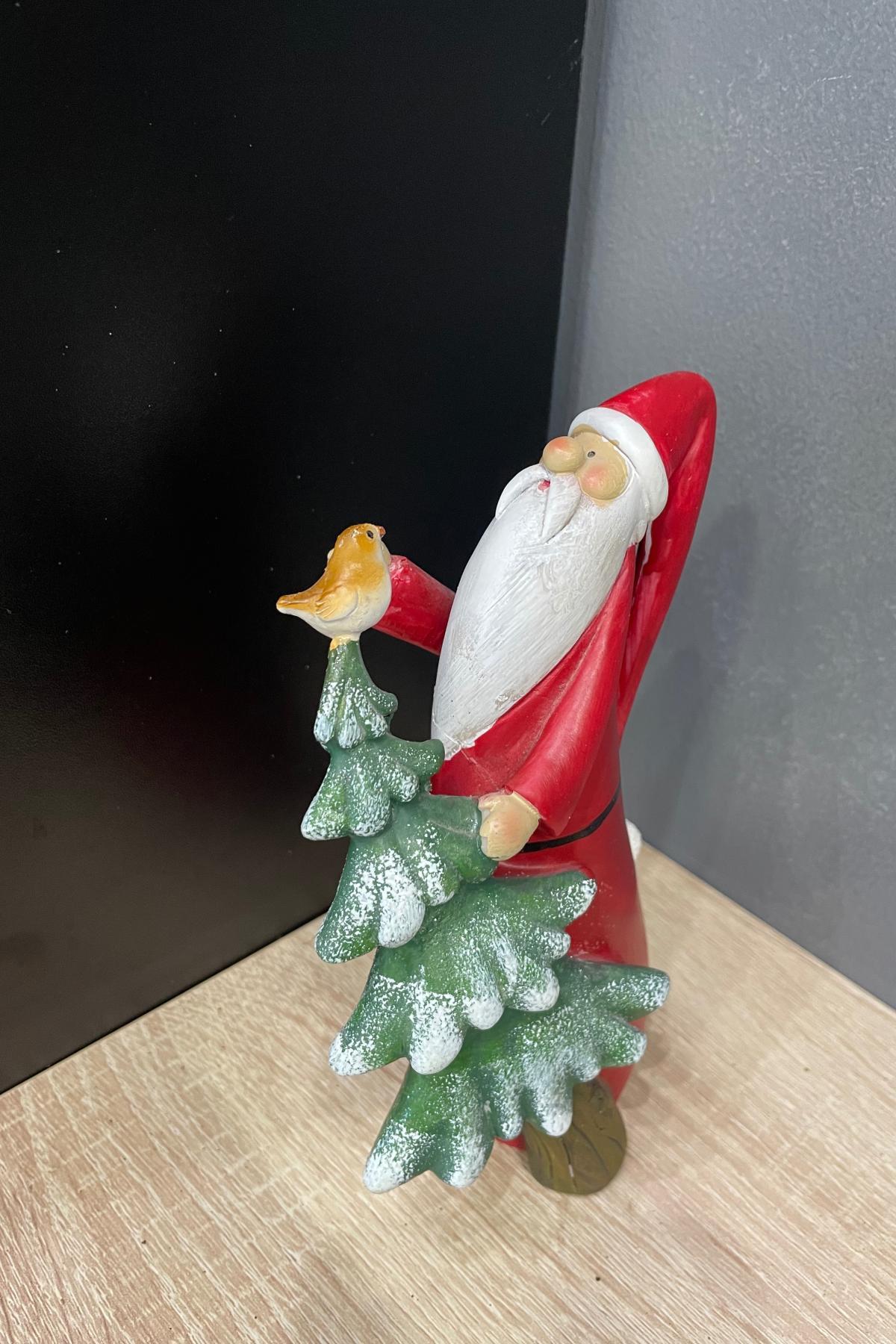 Дед Мороз несет елку